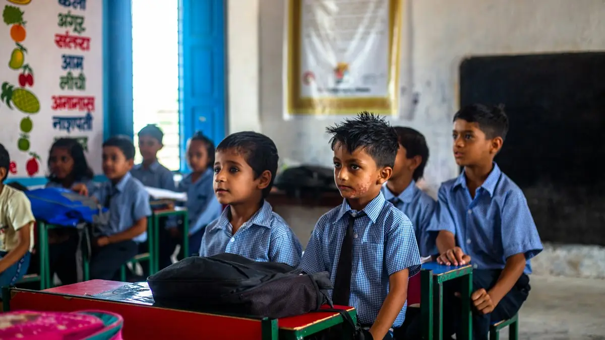 Young students in uniform sitting in their classroom.
